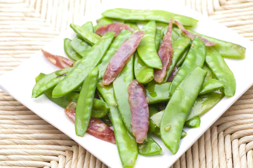 Snow peas sauted with sausage