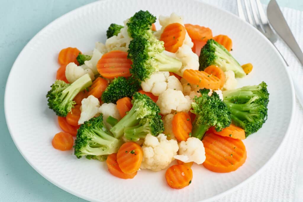 Steamed carrots, broccoli, and cauliflower