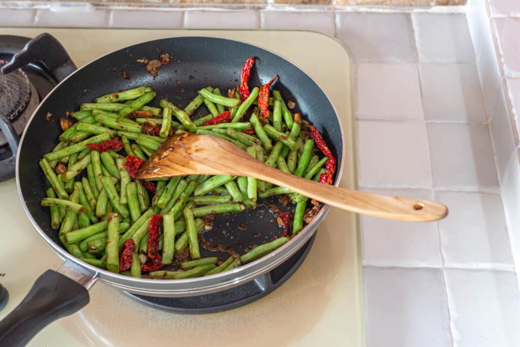 Snap beans sauted with dry chilis
