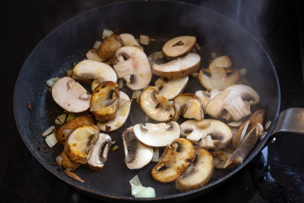 Steaming button mushrooms