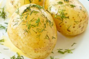 Boiled Yukon Gold potatoes with butter and dill