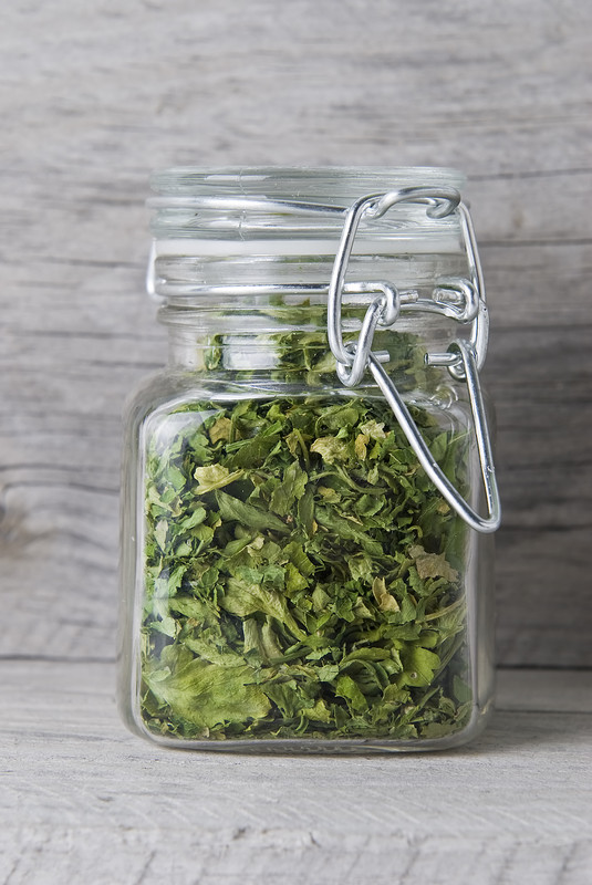 Dried parsley stored in a glass jar