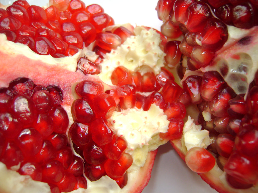 Pomegranate fruit; the grain like seeds are edible and tart