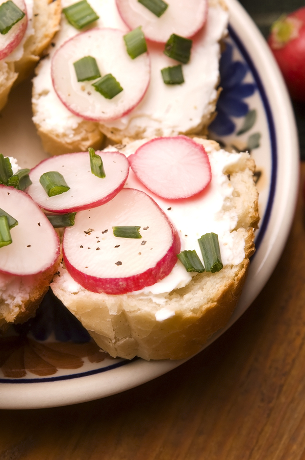 Sandwich with cheese, radishes, and chives